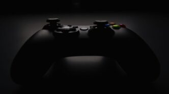 shallow focus photography of black Xbox controller