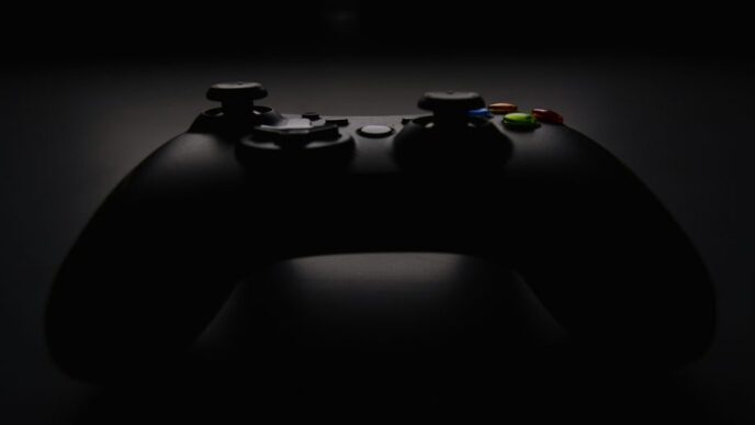 shallow focus photography of black Xbox controller
