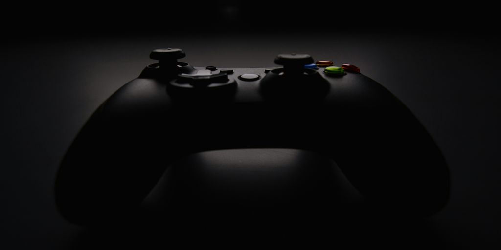 shallow focus photography of black Xbox controller