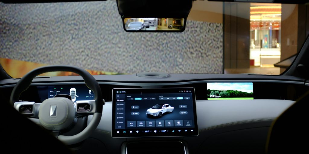 the interior of a car with a display of a car's dashboard
