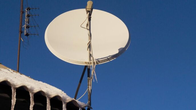 A satellite dish sitting on top of a roof