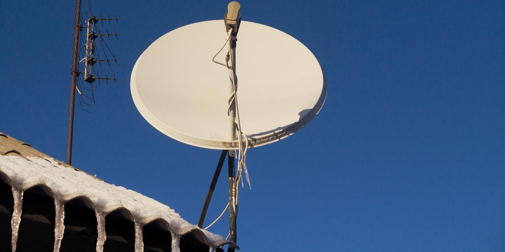A satellite dish sitting on top of a roof