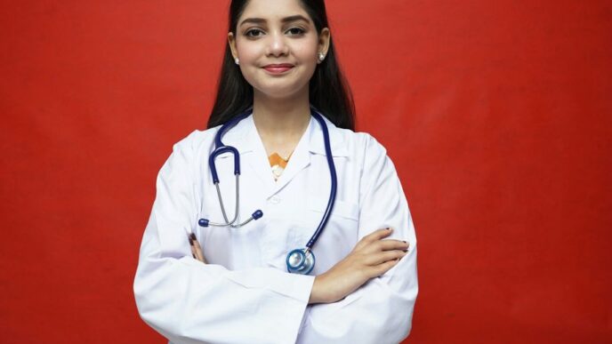 a woman in a white coat