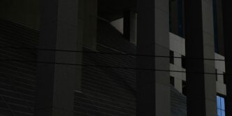 a clock on the side of a building at night