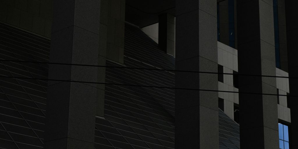 a clock on the side of a building at night