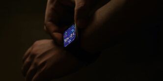 a person holding a smart phone in their hands