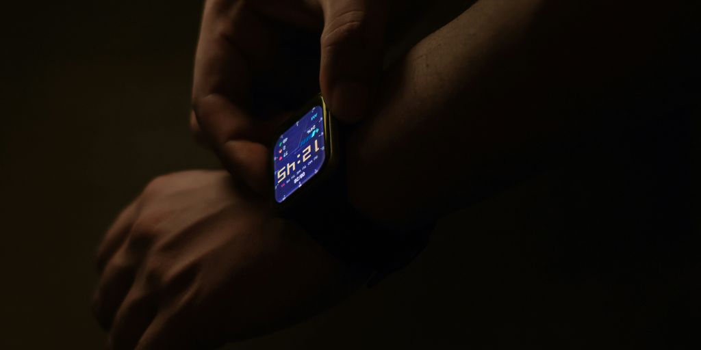 a person holding a smart phone in their hands