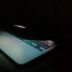 a laptop computer lit up in the dark