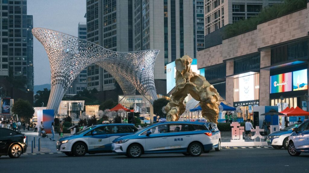a giant statue of a giant creature in the middle of a city