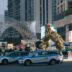 a giant statue of a giant creature in the middle of a city