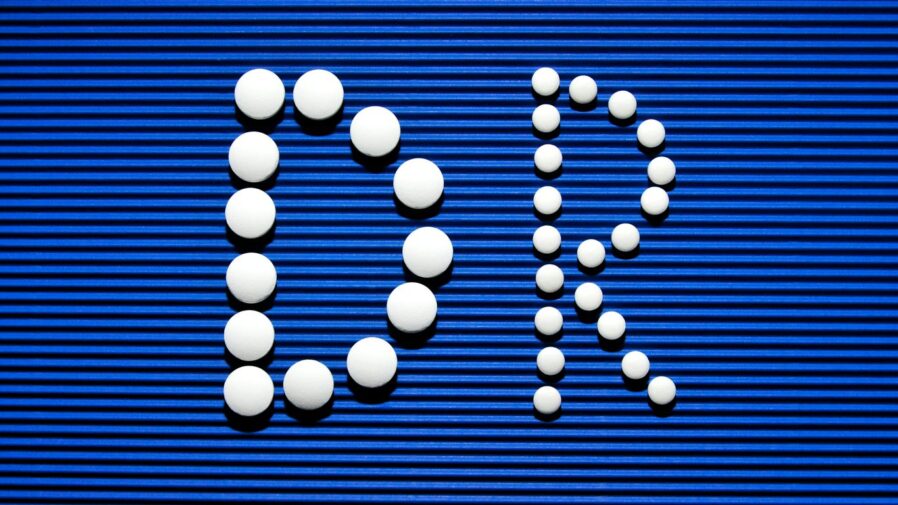 A blue sign with a bunch of white balls on it