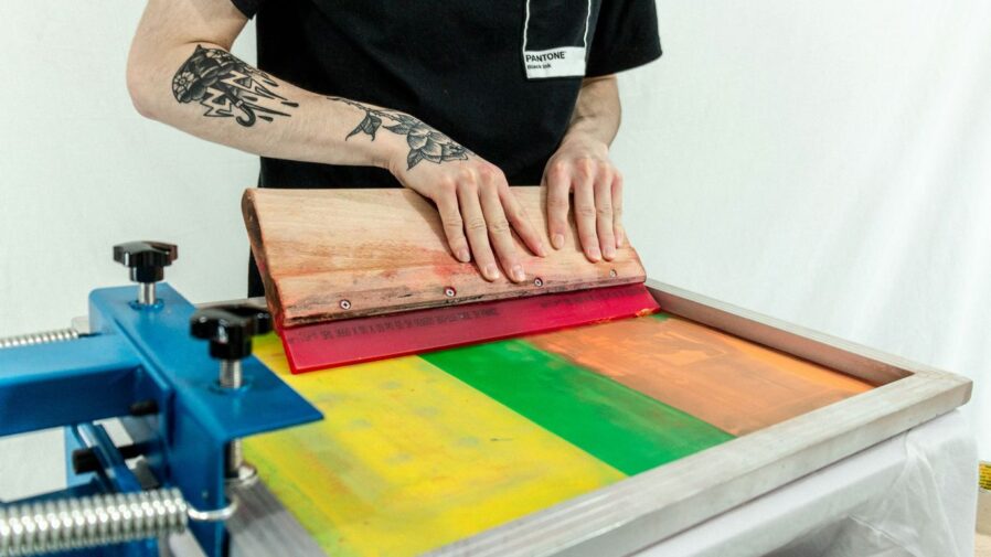 person in black t-shirt holding brown wooden board
