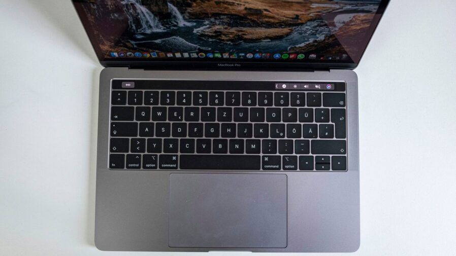 macbook pro on white table