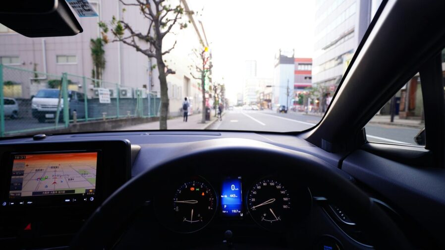 person riding vehicle on the street at daytime