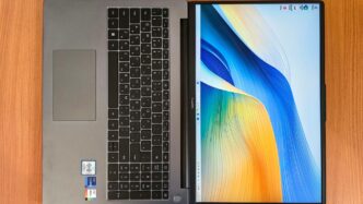 a laptop computer sitting on top of a wooden table