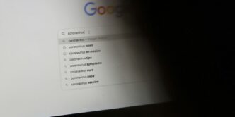 black laptop computer turned on displaying google search