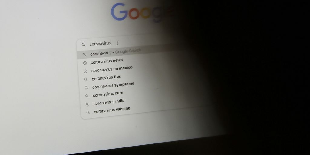black laptop computer turned on displaying google search