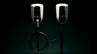 a couple of black and white phones on a black background