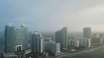 bird's eye view photography of high-rise buildings under gray sky