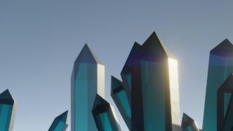 A group of blue glass sculptures in front of a blue sky