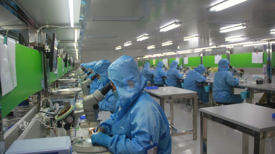 man in blue jacket wearing blue mask