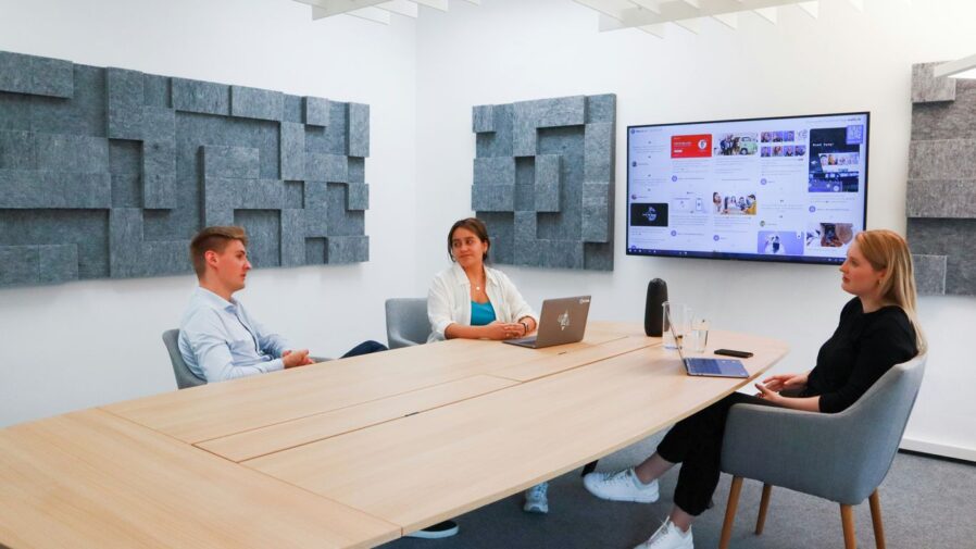 a group of people sitting around a conference table