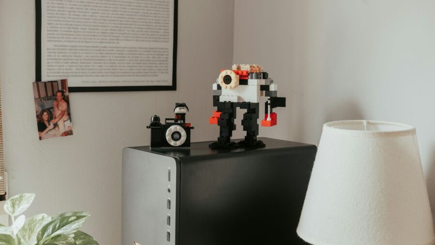 a table with a lamp and some legos on top of it
