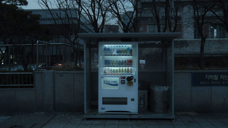 a vending machine sitting on the side of a road