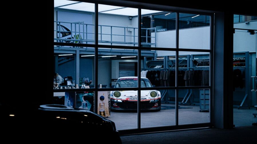 a car parked inside of a garage next to a window