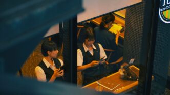 a group of young people sitting next to each other