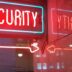 a red security sign and a blue security sign