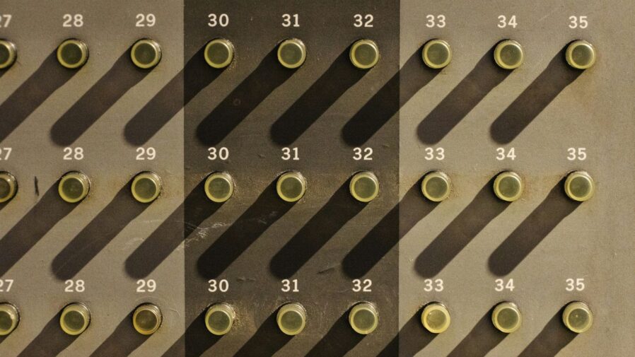 A wall with a lot of circles and numbers on it