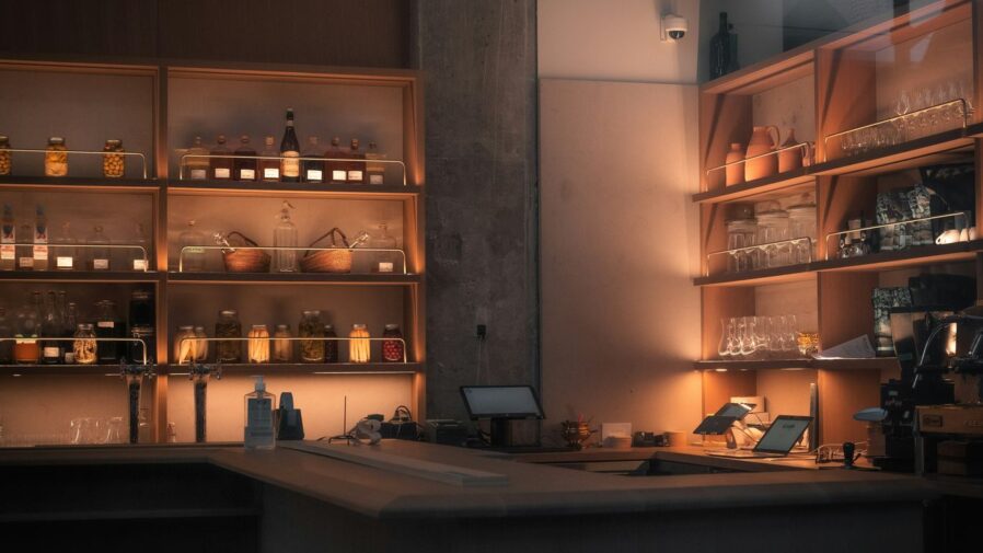 brown wooden shelf with bottles