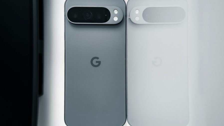 Two cell phones sitting next to each other