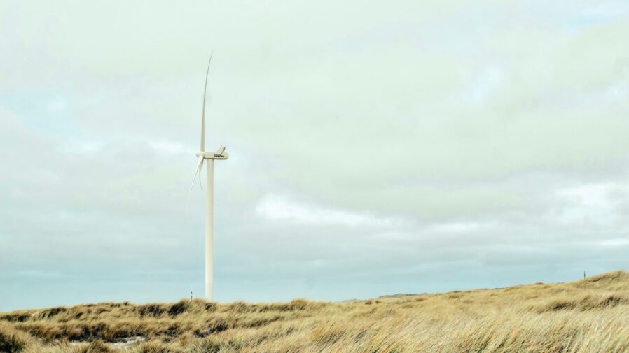 A wind turbine in the middle of a field