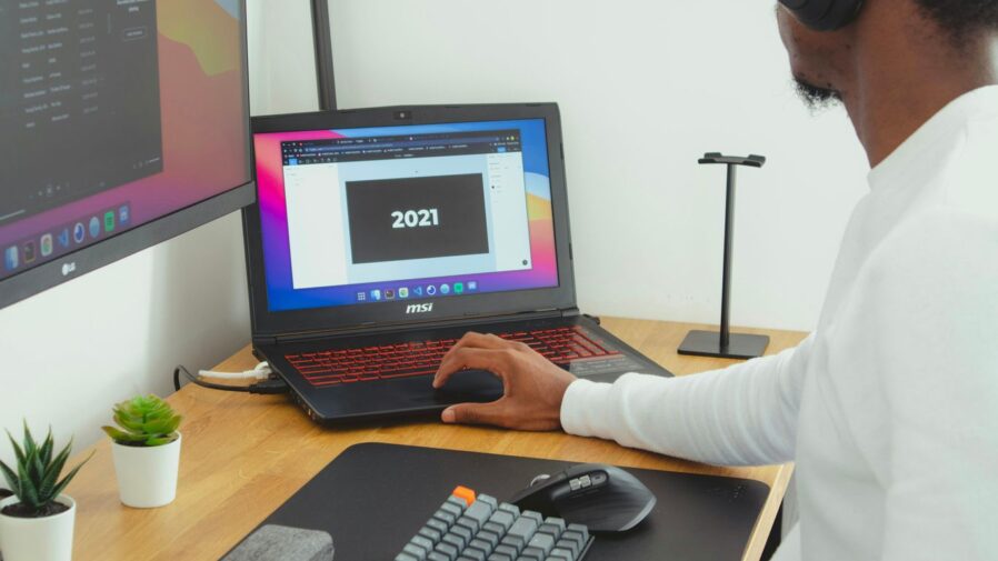 person using black laptop computer
