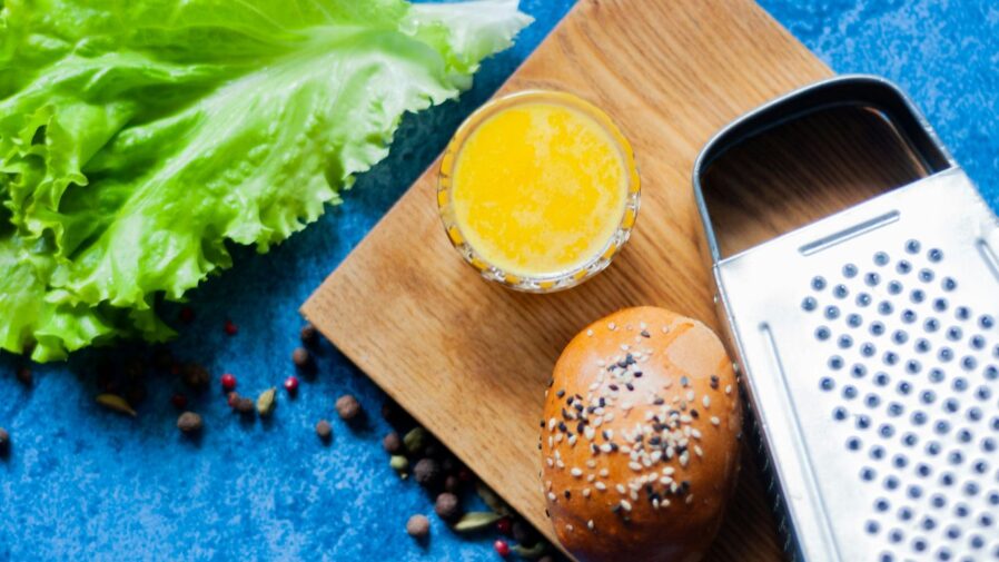 a cookie next to a bag of chips and a cell phone