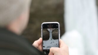 person using black smartphone