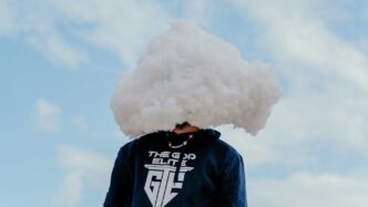 a person with a cloud on their head