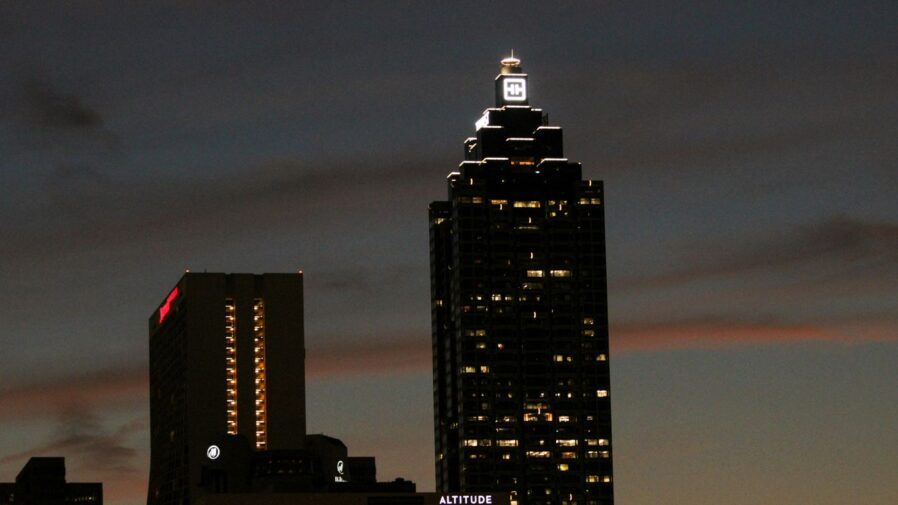a very tall building with a clock on it's side
