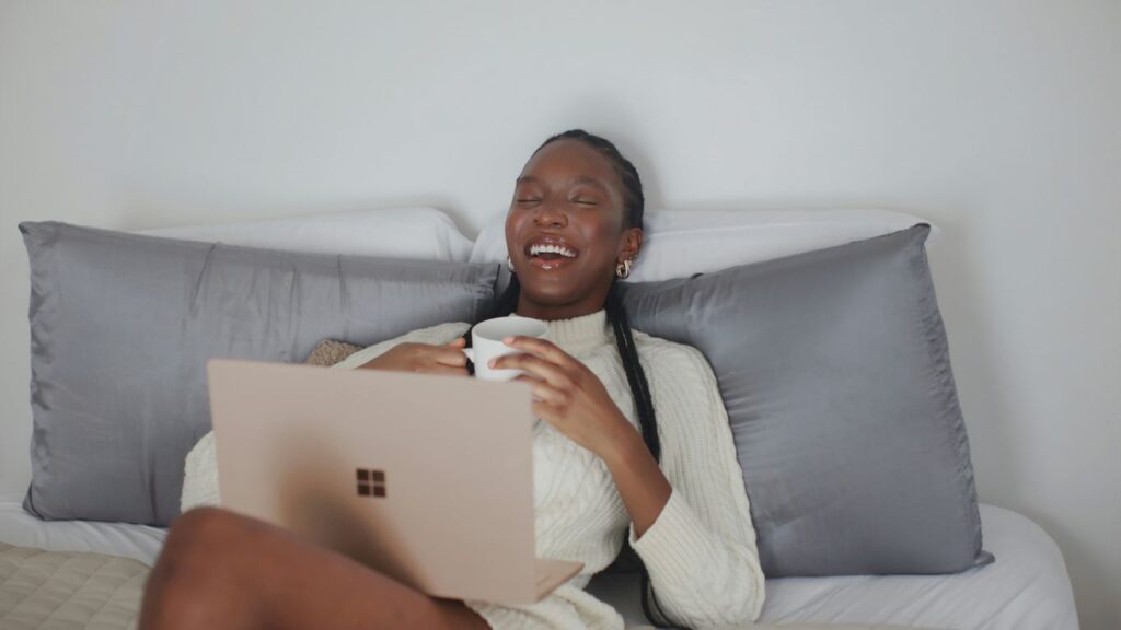 person in white long sleeve shirt holding Surface device