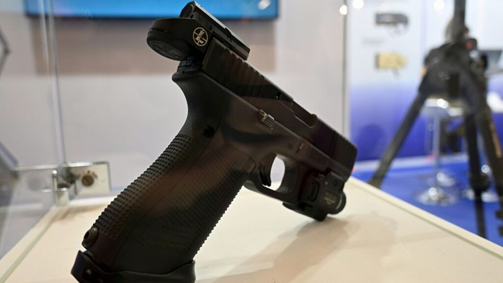 a close up of a gun on a table