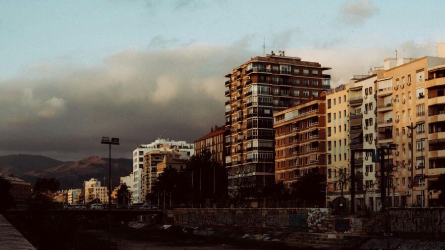 a river runs through a city with tall buildings