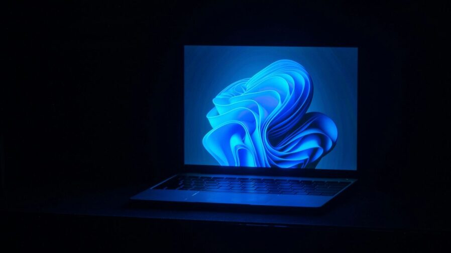 a macbook air laptop in a dark room