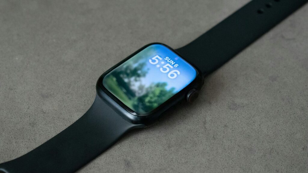 An apple watch displays a nature scene.