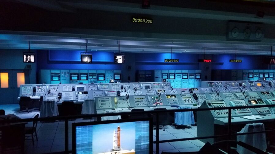 a room with many screens and monitors