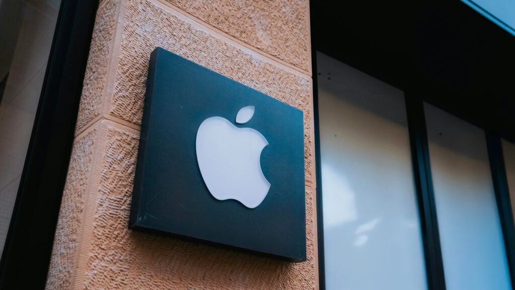 An apple sign on the side of a building