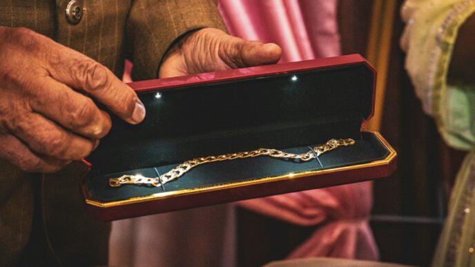 A man holding a box with a chain on it
