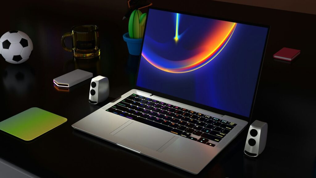 a laptop computer sitting on top of a desk