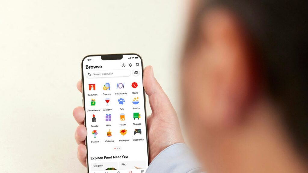 a person holding a cell phone in their hand